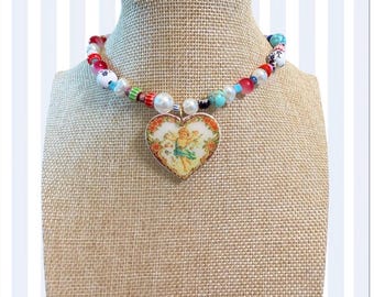Colorful beaded necklace with angel pendant