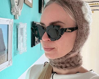 Fluffy knitted bonnet with flowers for women – soft winter hat, hand-knitted fashion accessory, tie-on balaclava