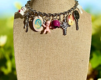 Handmade necklace with colorful pendants, charm necklace, key pendant, rose charm, vintage style, Madonna pendant, swan charm, stylish