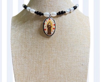 Pearl necklace with Virgin Mary charm