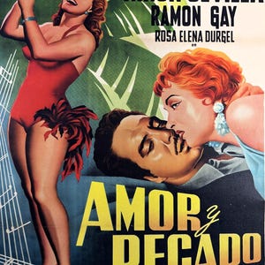 May include: A white ceramic mug with a black handle and the text "But First, Coffee" in a bold, black font. The mug is set against a blurred background, suggesting a cozy setting.