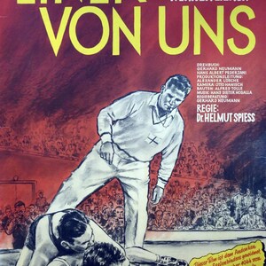 May include: Vintage movie poster for "Einer von Uns" featuring a wrestling scene with a referee. The poster has a red background with yellow text. The film's title is prominently displayed, along with the names of the actors and director.