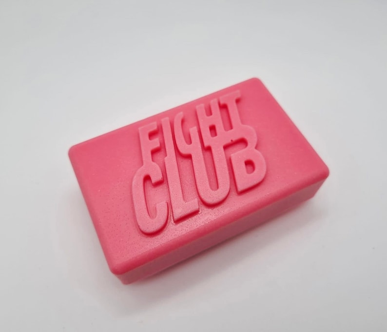 A pink rectangular soap with the words fight club written on the top.