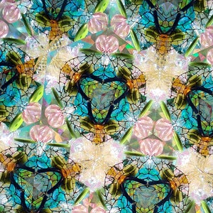 May include: A kaleidoscope image with a repeating pattern of blue, green, and orange geometric shapes. The shapes are arranged in a symmetrical pattern, creating a sense of depth and movement.