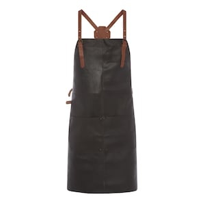May include: A black leather apron with brown leather straps and accents. The apron has two front pockets and a leather neck piece. The straps are adjustable with buckles. This apron is designed for kitchen or workshop use.