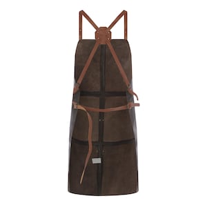 May include: A brown leather apron with tan leather straps. The apron has a cross-back design with adjustable straps and a waist tie. The apron appears to be made of durable material and is designed for use in a kitchen or workshop.