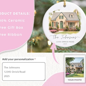 May include: A round white ceramic ornament featuring a watercolor illustration of a house with green shutters and a front door. The text reads The Johnsons, 12355 ORRICK ROAD, and 2025. A gold string is attached to the top for hanging on a tree.