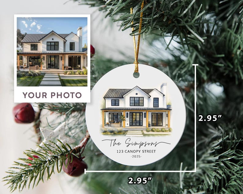 May include: A round white ceramic ornament measuring 2.95 inches by 2.95 inches, featuring a watercolor illustration of a two-story house with black trim. Below the house, the text reads The Simpsons, 123 CANOPY STREET, and 2025 in black font.