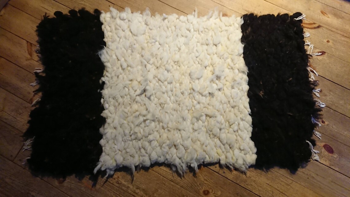 Hand woven peg loom rug made with natural sheep fleece. Etsy
