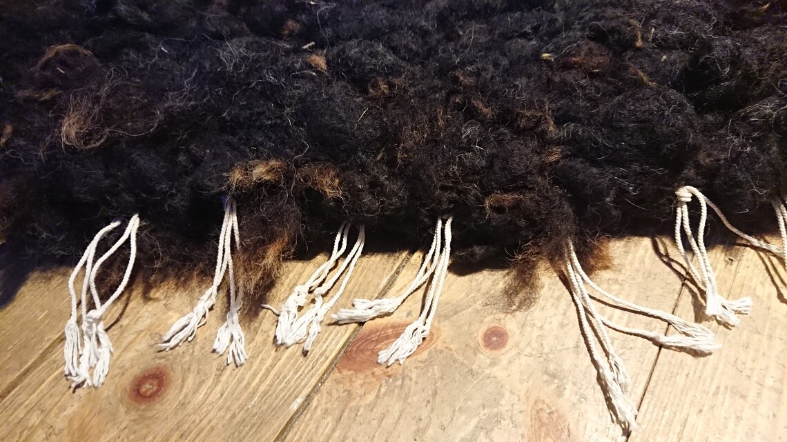 Hand woven peg loom rug made with natural sheep fleece. Etsy