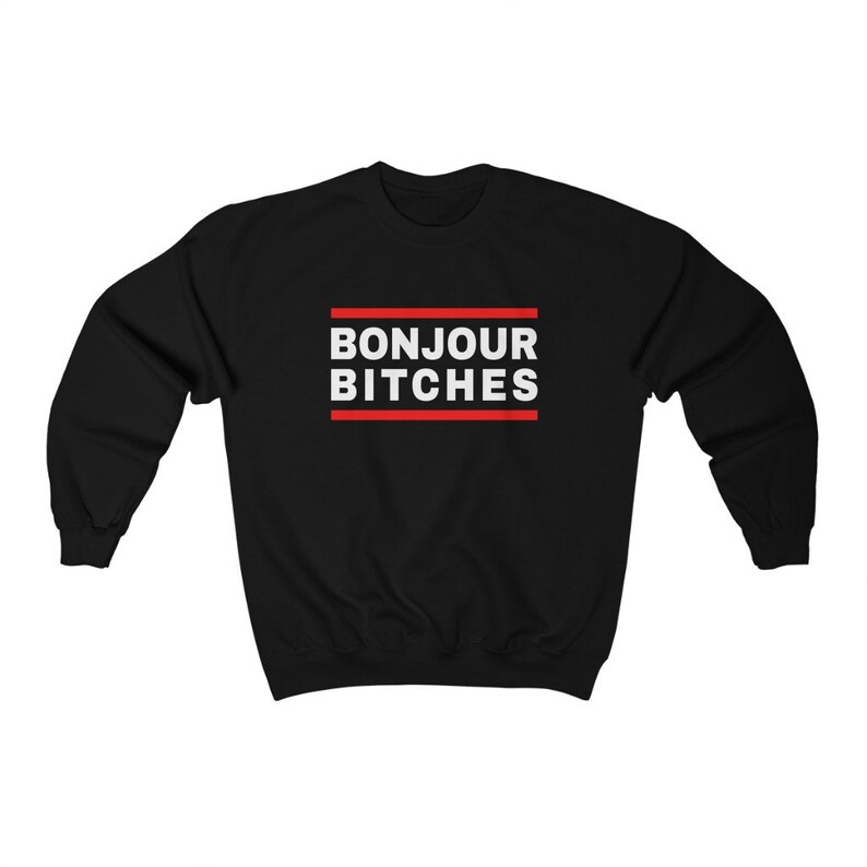 May include: Black sweatshirt with the text "BONJOUR BITCHES" in white, framed by two red lines. The sweatshirt is a crew neck style, suitable for casual wear.