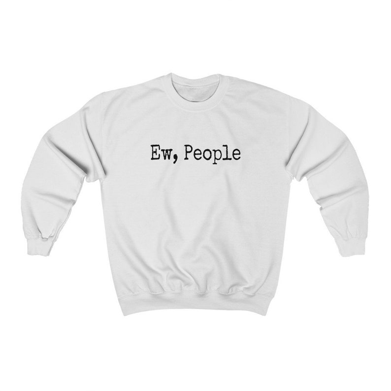 May include: White sweatshirt with the text "Ew, People" in black, centered on the chest. The long-sleeved crewneck top is made of a soft material. A casual, comfortable garment.