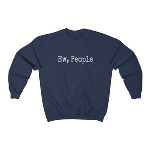May include: Navy blue sweatshirt with the text "Ew, People" in white, centered on the chest. The long-sleeved crewneck top is made of a soft material.