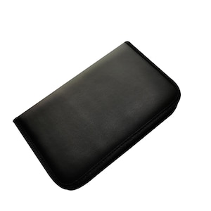 May include: A black zippered case with a smooth, textured surface.