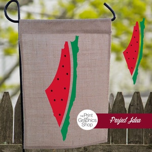 May include: A burlap garden flag featuring a red watermelon slice with black seeds and a green rind. The flag has a black metal hanger and is displayed outdoors. The text "Project Idea" is on a burgundy banner.