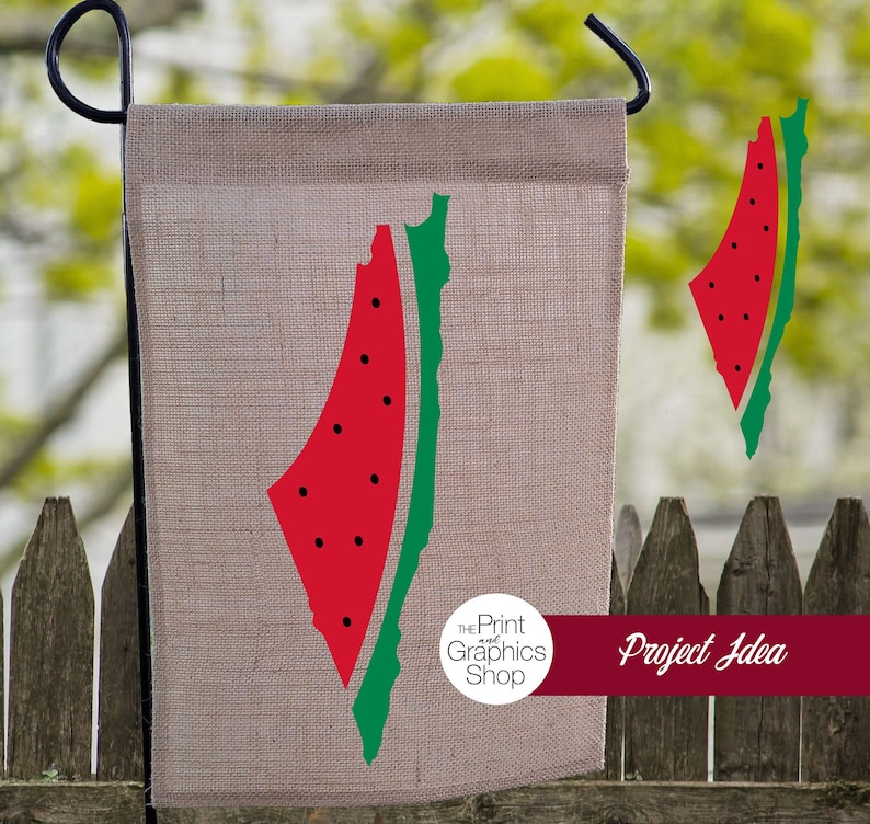 May include: A burlap garden flag featuring a red watermelon slice with black seeds and a green rind. The flag has a black metal hanger and is displayed outdoors. The text "Project Idea" is on a burgundy banner.