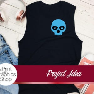 May include: Black sleeveless shirt with a light blue skull graphic. The skull has crossbones for eyes and heart-shaped pupils. The image also includes jeans, headphones, and sneakers. The text "Project Idea" is visible.