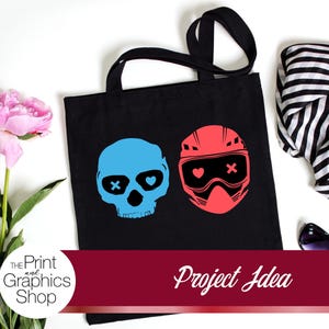 May include: Black tote bag featuring a blue skull with an X eye and a red helmet with a heart and X. The bag is next to pink peonies, a black and white striped scarf, and sunglasses. The text "Project Idea" is on a burgundy banner.