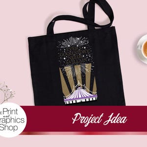 May include: A black tote bag featuring a graphic print of a purple and white circus tent with gold spotlights and white stars. The text reads, "EVERY GOOD STORY NEEDS A VILLAIN." The design includes a firework-like burst above the text.