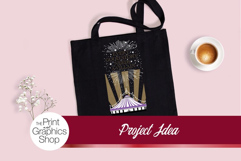 May include: A black tote bag featuring a graphic print of a purple and white circus tent with gold spotlights and white stars. The text reads, "EVERY GOOD STORY NEEDS A VILLAIN." The design includes a firework-like burst above the text.