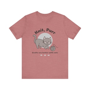 May include: A heather red t-shirt with a gray cat illustration and the text "Knit, Purr. Crafts are better with cats."