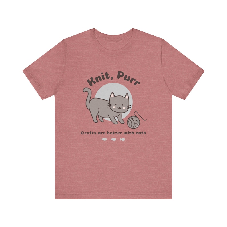 May include: A heather red t-shirt with a gray cat illustration and the text "Knit, Purr. Crafts are better with cats."