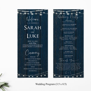 May include: A navy blue wedding program with a rustic woodgrain background and white string lights. The program includes the names Sarah and Luke, the wedding date, time, and location. It also lists the ceremony order and the wedding party.