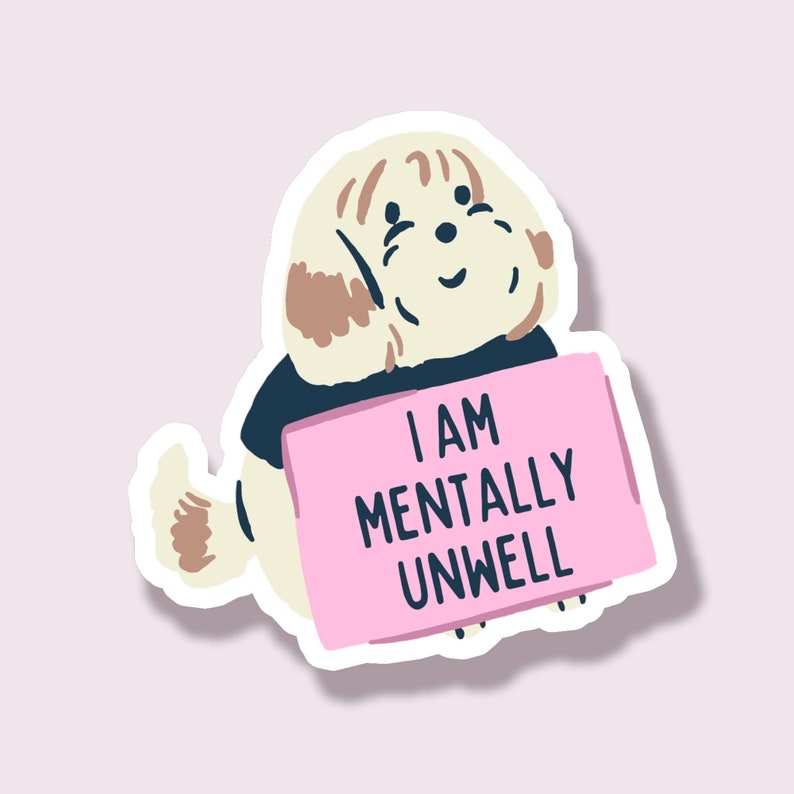 May include: A sticker featuring a cartoon dog with cream-colored fur and brown patches, wearing a navy blue shirt. The dog holds a pink sign with the text "I AM MENTALLY UNWELL" in black.