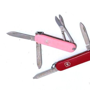 A pair of Small Pocket knives Made by  Switzerland Victorinox Anniversary Multi Tools Swiss Army Knife Box Wenger Northwave Swiss Army Knife