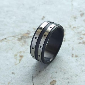 Mens titanium black ring with silver accents - dotted deep black titanium modern ring - band for him with a distinctive burned effect