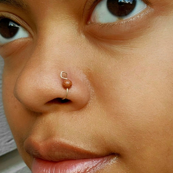 Nose Ring | Buy Diamond Nose Ring Online | Latest Diamond Nose Pin Designs  at Tanishq | Diamond nose ring, Simple diamonds, Nose ring online