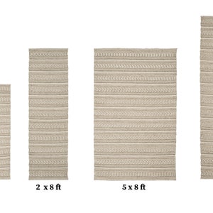 May include: A set of five beige woven rugs in various sizes, ranging from 3x5 feet to 8x10 feet. The rugs have a subtle striped pattern.