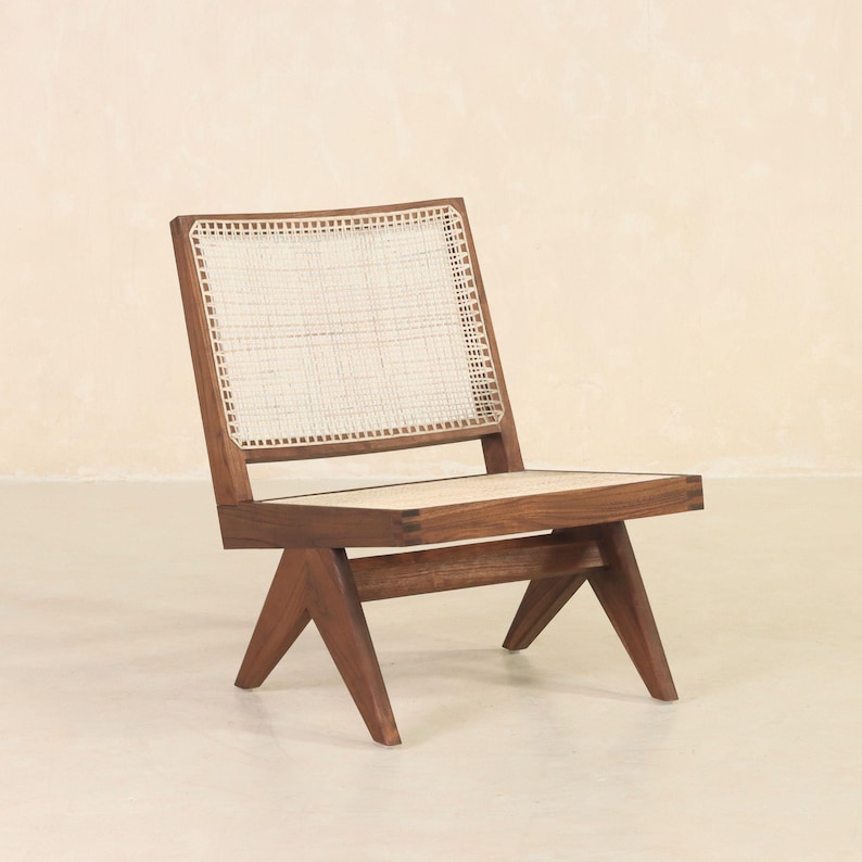 May include: A wooden chair with a woven cane seat and back. The chair has a dark brown finish and a simple, modern design.