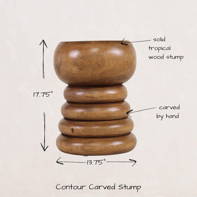 May include: A solid wood stump stool, carved by hand, with a rounded top and a stepped base. The stool is 17.75 inches tall and 13.75 inches wide.