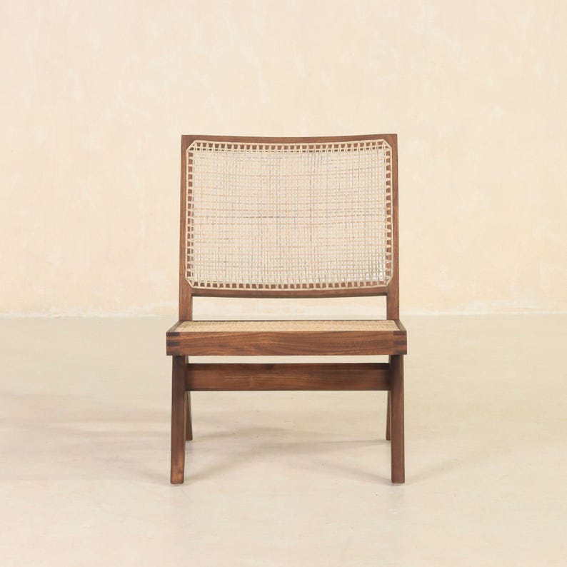 May include: A wooden chair with a woven cane seat and back. The chair has a dark brown finish and a simple, modern design.