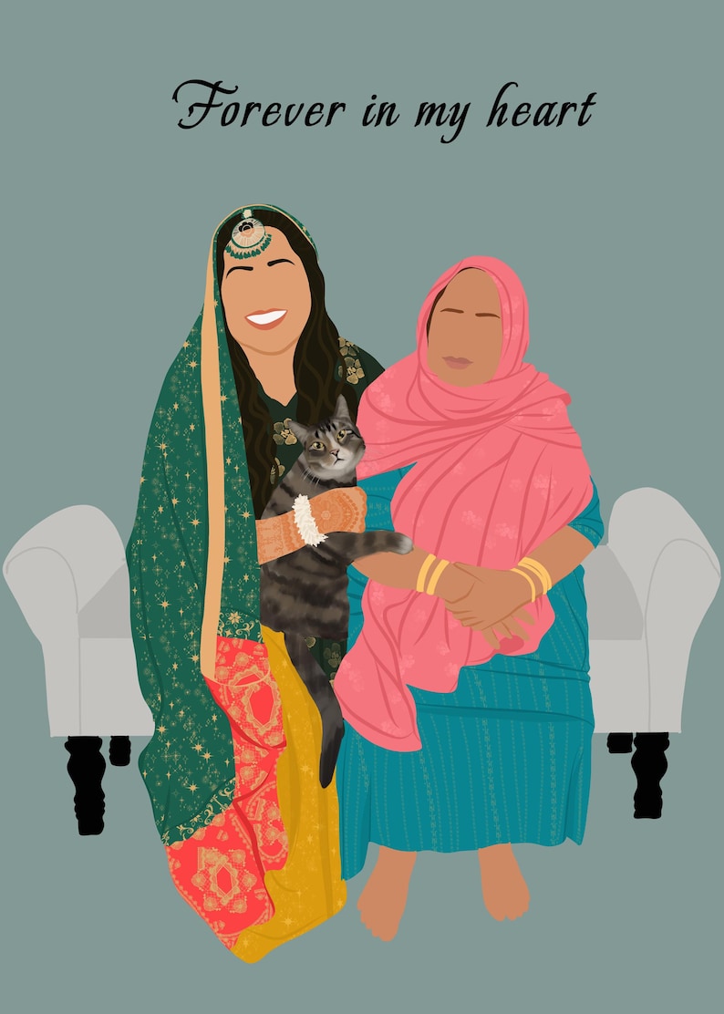 May include: Two women in traditional clothing are sitting on a white couch with a cat. The woman on the left is wearing a green and gold patterned dress with a pink scarf. The woman on the right is wearing a pink scarf and a blue and white patterned dress. The cat is gray and white and is sitting on the woman's lap. The text "Forever in my heart" is written at the top of the image.