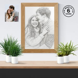 May include: A pencil sketch portrait of a smiling couple in a wooden frame. The artwork depicts a man and woman embracing, with intricate details in their clothing and expressions. The frame is a light brown color. The text "READY IN 6 HOURS" is in a black circle.