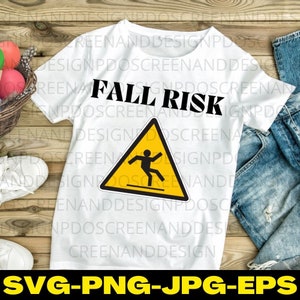 May include: White t-shirt with the text "Fall Risk" in black letters and a yellow warning sign with a stick figure falling. The sign has a black border.