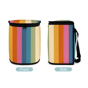 May include: A striped lunch bag with a rainbow pattern. The bag is shown from the front and side. The bag has a zipper closure and a handle.