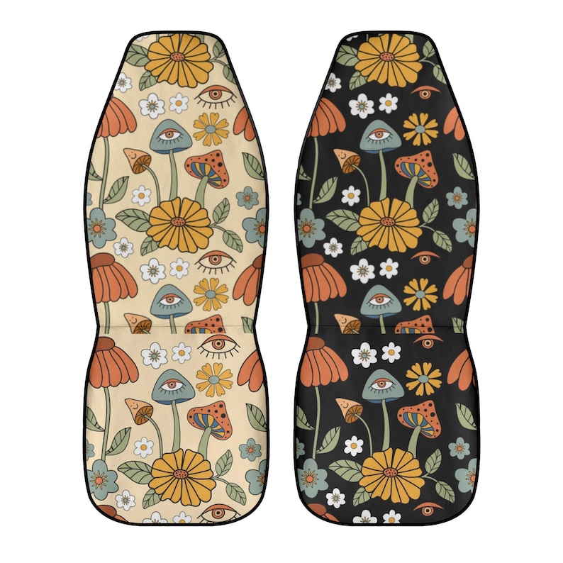 May include: Two car seat covers featuring a repeating pattern of yellow flowers, orange petals, green leaves, small white blossoms, and mushrooms with eyes. One cover has a light beige background, while the other has a solid black background.