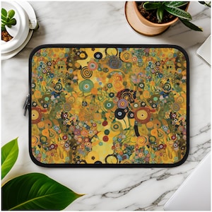 May include: A laptop sleeve with a colorful abstract design featuring circles, swirls, and dots in shades of yellow, green, blue, and red. The sleeve has a black zipper and a black border.