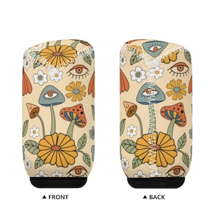 May include: A cream-coloured can cooler with a psychedelic pattern featuring mushrooms, flowers, and eyes. The front and back of the cooler are shown.