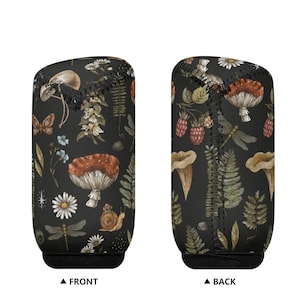 May include: A black neoprene can cooler with a whimsical forest pattern. The design features mushrooms, butterflies, dragonflies, berries, and ferns in shades of red, brown, green, and white.