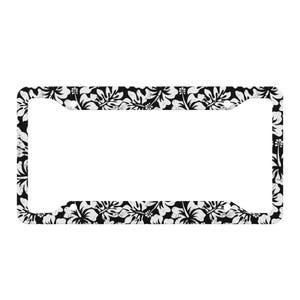 Puede incluir: Marco para matrícula de coche negro y blanco con un patrón floral. El marco está hecho de metal y tiene un tamaño estándar.