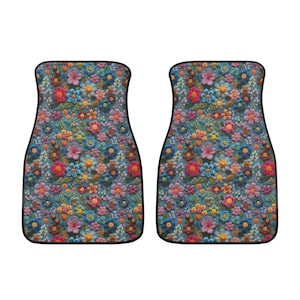 May include: A set of two car floor mats with a colorful floral pattern. The mats are made of a durable material and feature a non-slip backing.