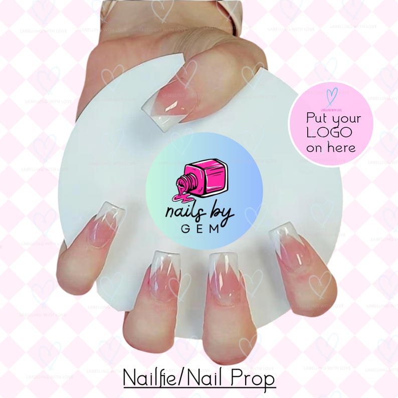 May include: A white nail prop with a pink and blue logo that says "nails by GEM". The prop is holding five nails with a clear and pink ombre design. The text "Put your LOGO on here" is also visible.