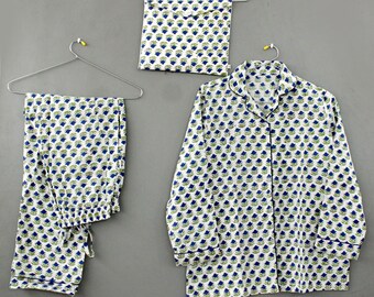 May include: A white pajama top with a blue and green floral pattern. The top has a collar and long sleeves. The pajama pants are also white with the same floral pattern.