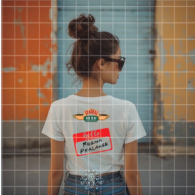 May include: White t-shirt with the "Central Perk" logo and a red name tag that says "hello Regina Phalange". The person is wearing sunglasses and jeans. The background is a colorful wall.
