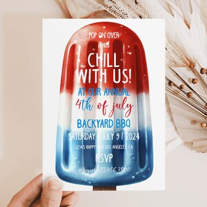 May include: A red, white, and blue popsicle-shaped invitation for a 4th of July backyard BBQ. The invitation reads "Pop on over and chill with us! At our annual 4th of July backyard BBQ. Saturday July 9, 2024. 12345 Happy Way Los Angeles CA. RSVP Megan 123.456.7990"