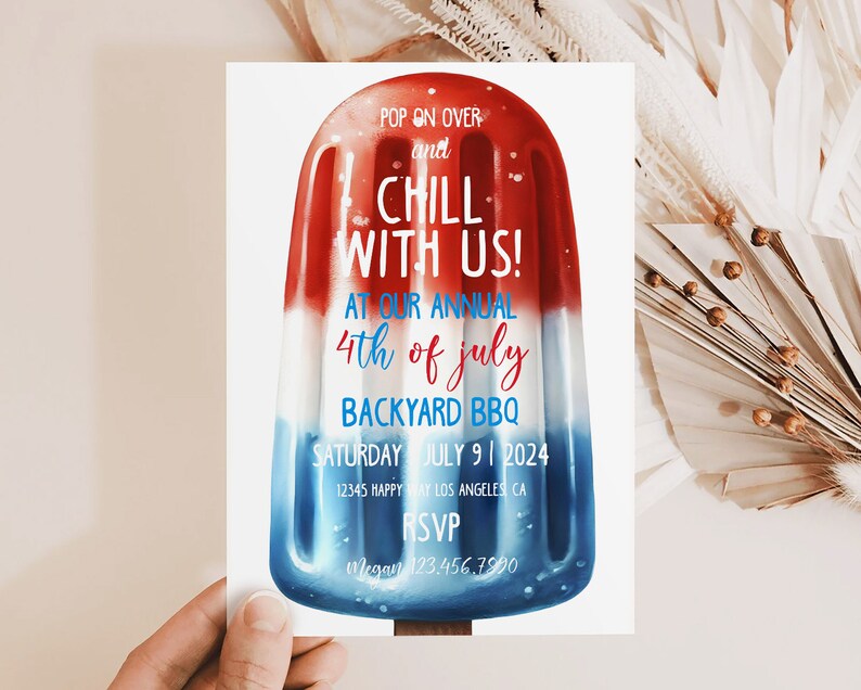 May include: A red, white, and blue popsicle-shaped invitation for a 4th of July backyard BBQ. The invitation reads "Pop on over and chill with us! At our annual 4th of July backyard BBQ. Saturday July 9, 2024. 12345 Happy Way Los Angeles CA. RSVP Megan 123.456.7990"
